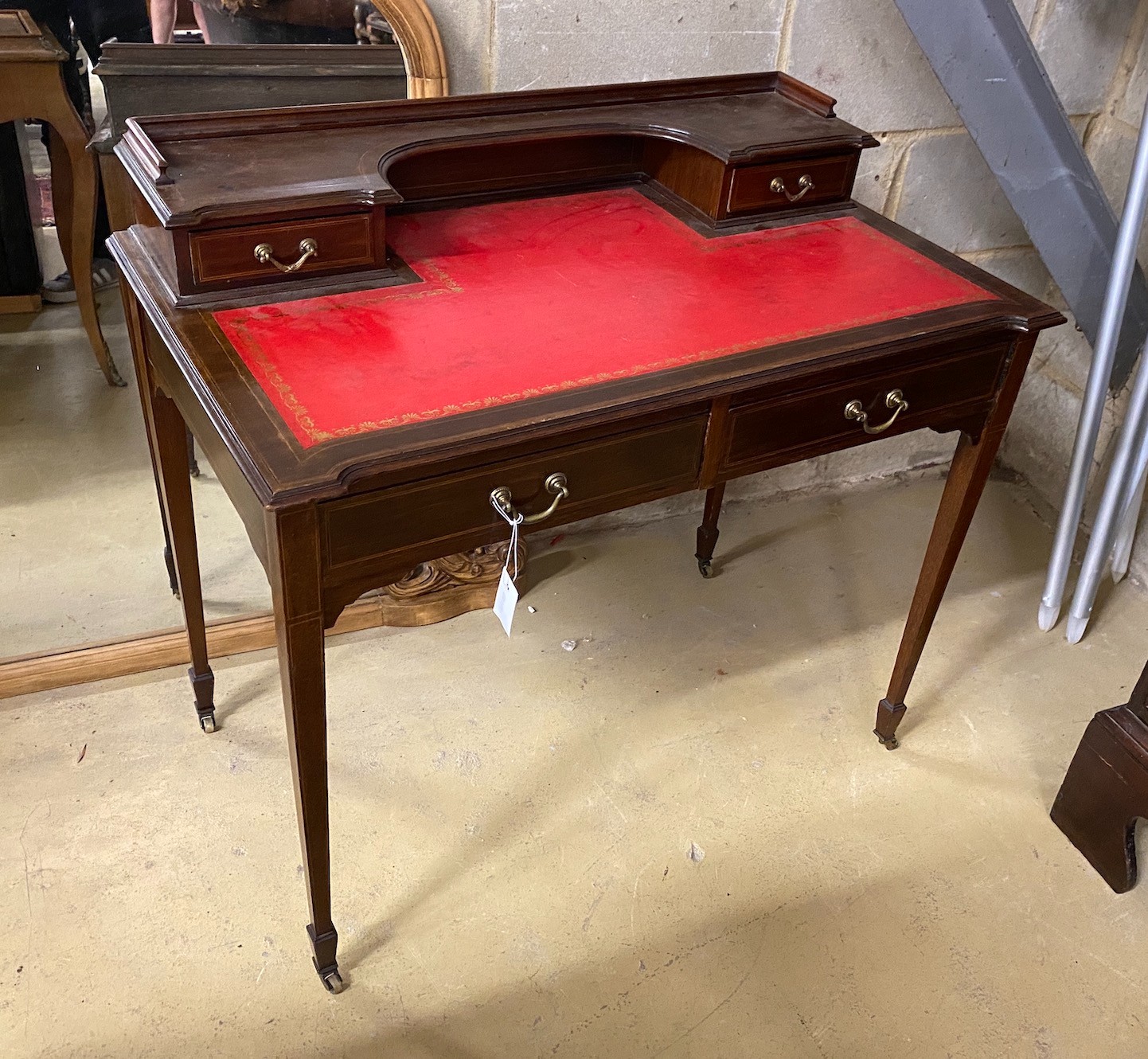 An Edwardian inlaid mahogany writing table, width 91cm